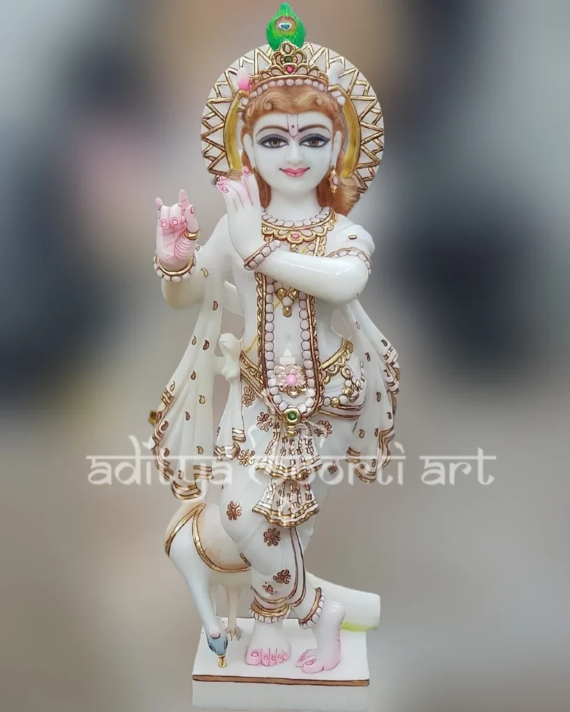 golden painted krishna marble statue