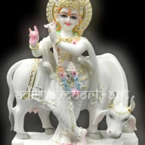 marble Krishna statue with cow