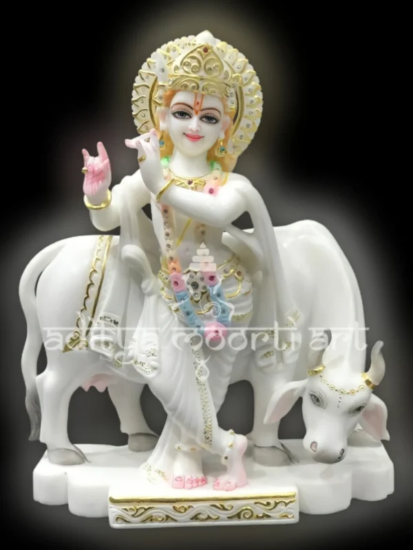 marble Krishna statue with cow