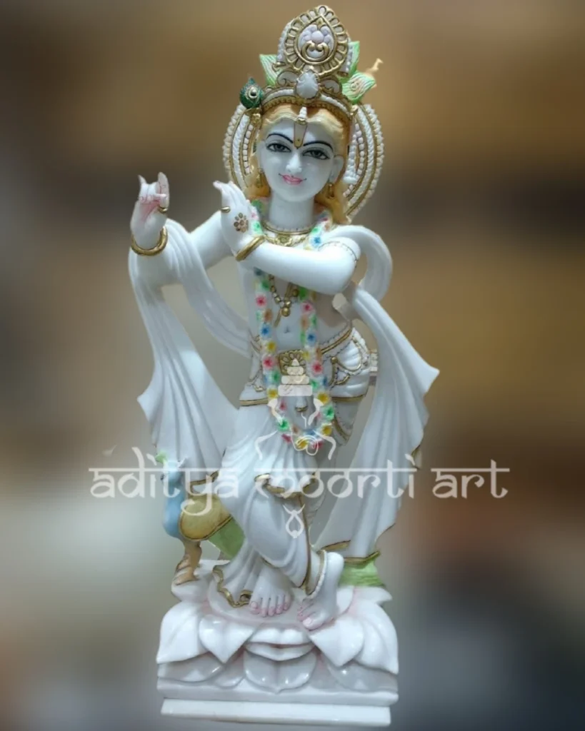 marble Krishna statue with peacock