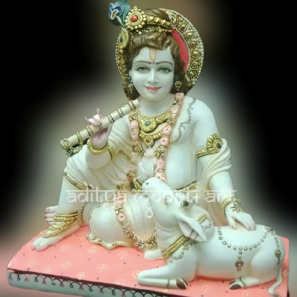 marble krishna statue with cow sitting position